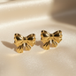 Gold bow stud earrings with shiny polished bowknot design